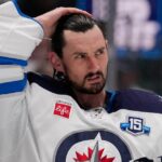 Winnipeg Jets suspend Connor Hellebuyck for failing to report to training camp