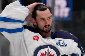 Winnipeg Jets suspend Connor Hellebuyck for failing to report to training camp