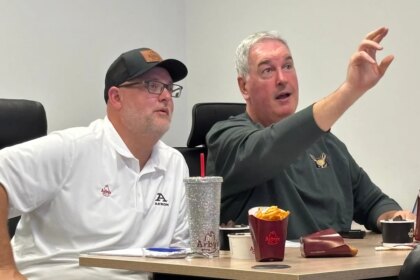 Akron ‘Offensive Coordinator of Game’ meets with Zips coach. Game day next