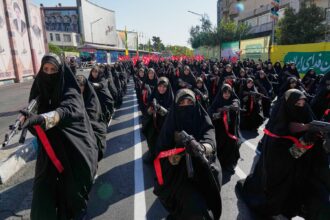 Iranians rally by the hundreds of thousands in biggest show of defiance since war began